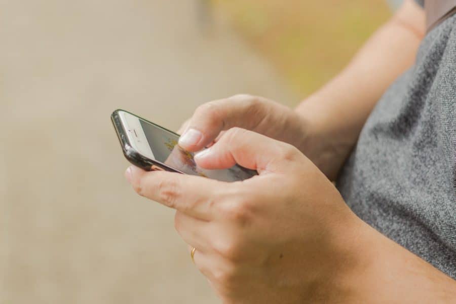 woman using mobile card reader